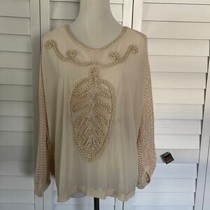 Simple Couture Crotchet NWOT Top with crotchet back and sheer front.